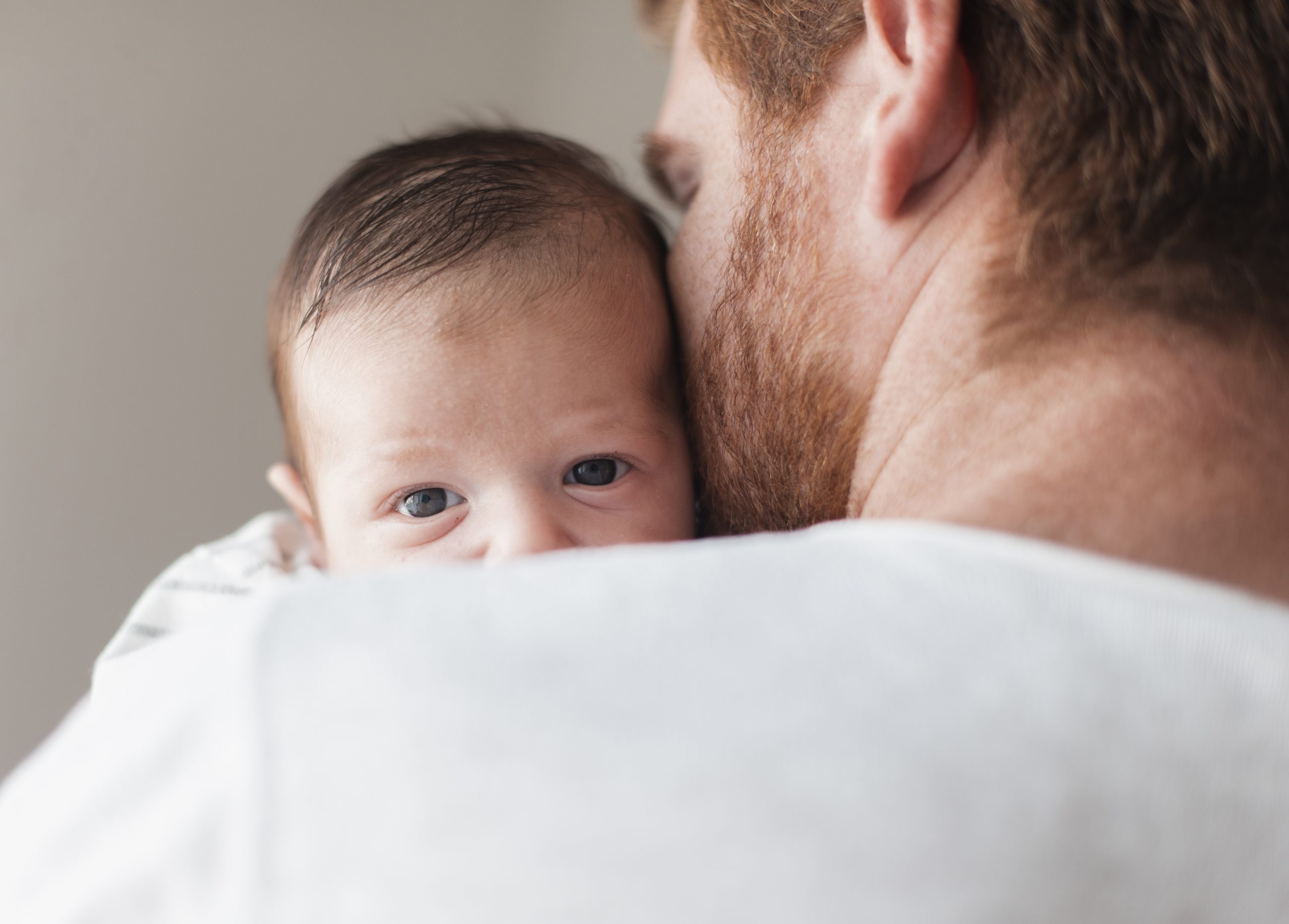 close-up-father-holding-baby-back-view